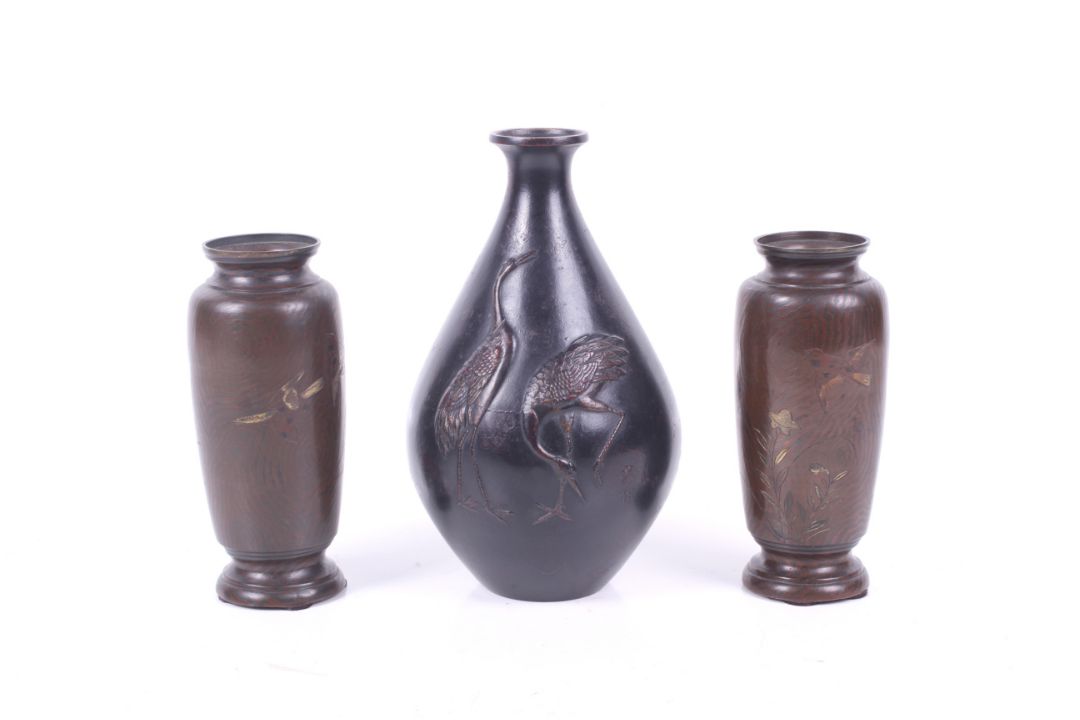 A pair of small bronze Japanese Meiji period vases and a further vase with cranes. - Image 1 of 3