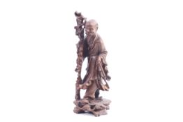 A Chinese hardwood carving of an old man.
