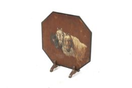 A wooden octagonal fire screen. The front painted with a scene of three horses, H66cm.