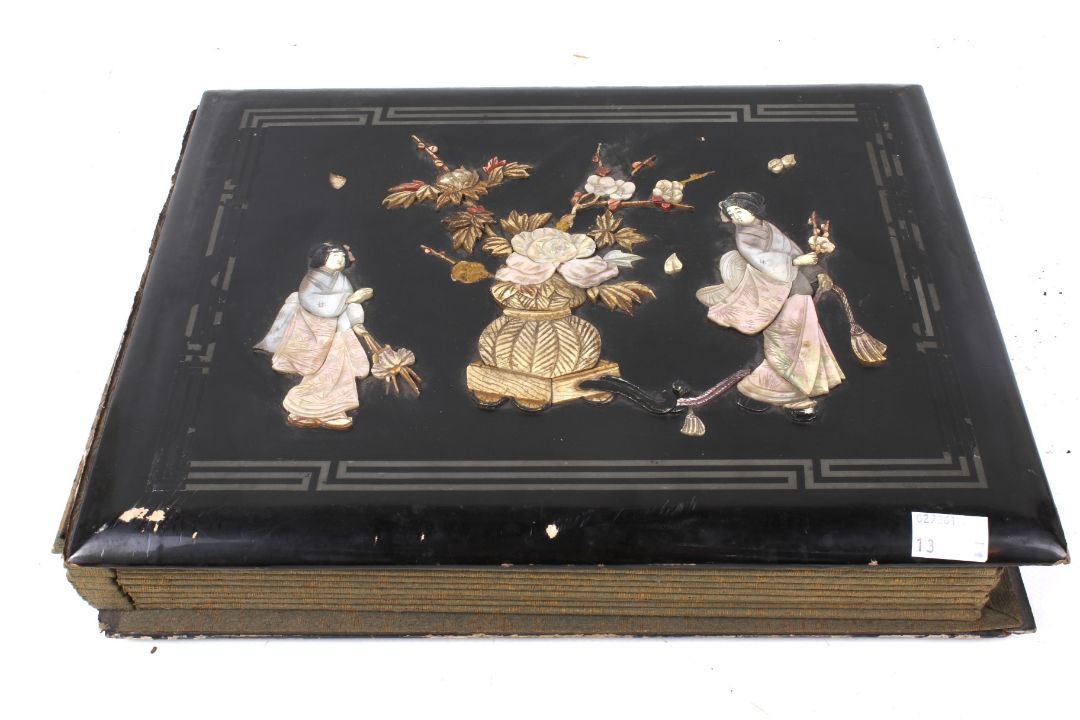A Japanese early 20th century lacquer album of period photographs and postcards. - Image 1 of 7
