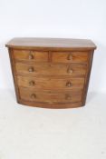 A Edwardian mahogany veneer bow fronted chest of drawers.