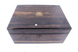 A 19th century coromandel box. The hinged cover inset with carved bone edelweiss.