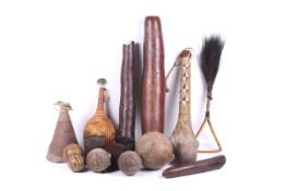 Papua New Guinea. A group of carved armbands, spheres, a club, etc.