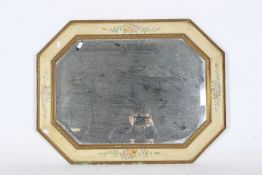 A vintage bevelled edge wall mirror.