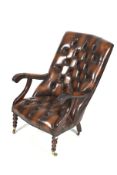 A contemporary mahogany button back library style chair.
