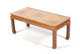 A contemporary hardwood Chinese style coffee table.