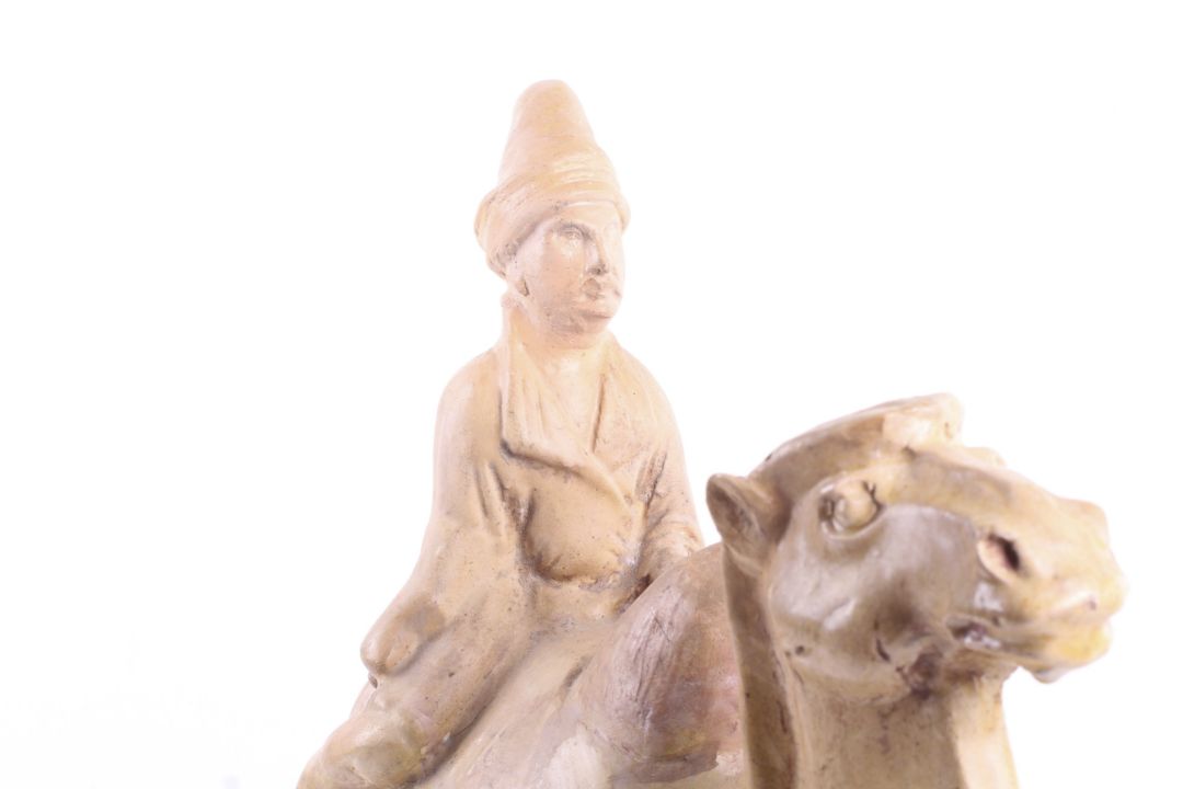 A large Chinese Tang Dynasty earthenware camel and rider. - Image 4 of 5