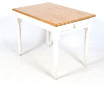 A contemporary pine top kitchen table.