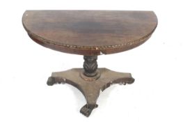 A Victorian mahogany veneered demi-lune table.