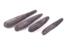 Papua New Guinea. Four stone and hardwood clubs.