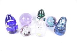 Seven contemporary glass paperweights. Including Caithness and Wedgwood.