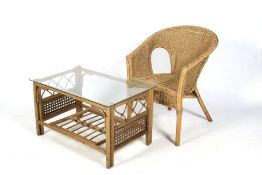 A vintage wicker chair and a bamboo framed coffee table.