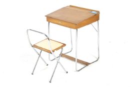 A vintage Tri-ang child's desk and chair.