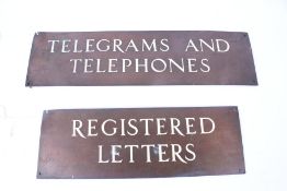 Two early 20th century bronze office door signs.