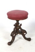 A Victorian beech adjustable music stool.