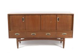 A mid-century G-Plan Tola wood sideboard with bi-fold doors.