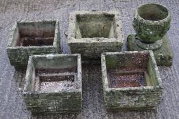 Five reconstituted stone garden planters.