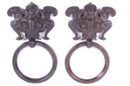 A pair of Tibetan bronze 'temple' door handles.