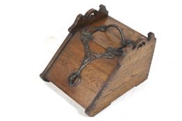 Art Nouveau coal scuttle. Oak with an ornate metalwork handle and hinge with liner.