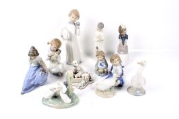 Eleven Spanish porcelain animals and children figures.