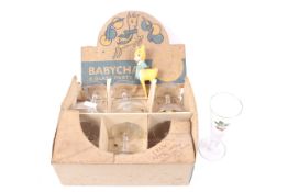 A boxed set of six Babycham glasses.