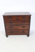 A 20th century mahogany veneered chest of drawers.