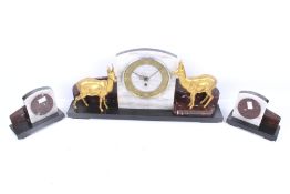 Art Deco marble clock garniture. Decorated with two gilt metal deer.