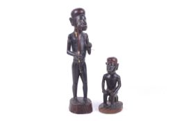 Two Solomon Island carved wood figures.