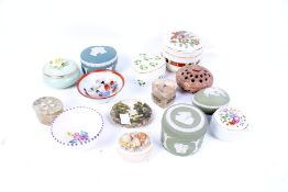 A collection of porcelain lidded boxes.
