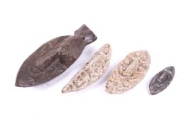 Papua New Guinea. Four hardwood and stone carved ancestral heads.