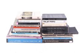 A large collection of books, primarily regarding Papua New Guinea.