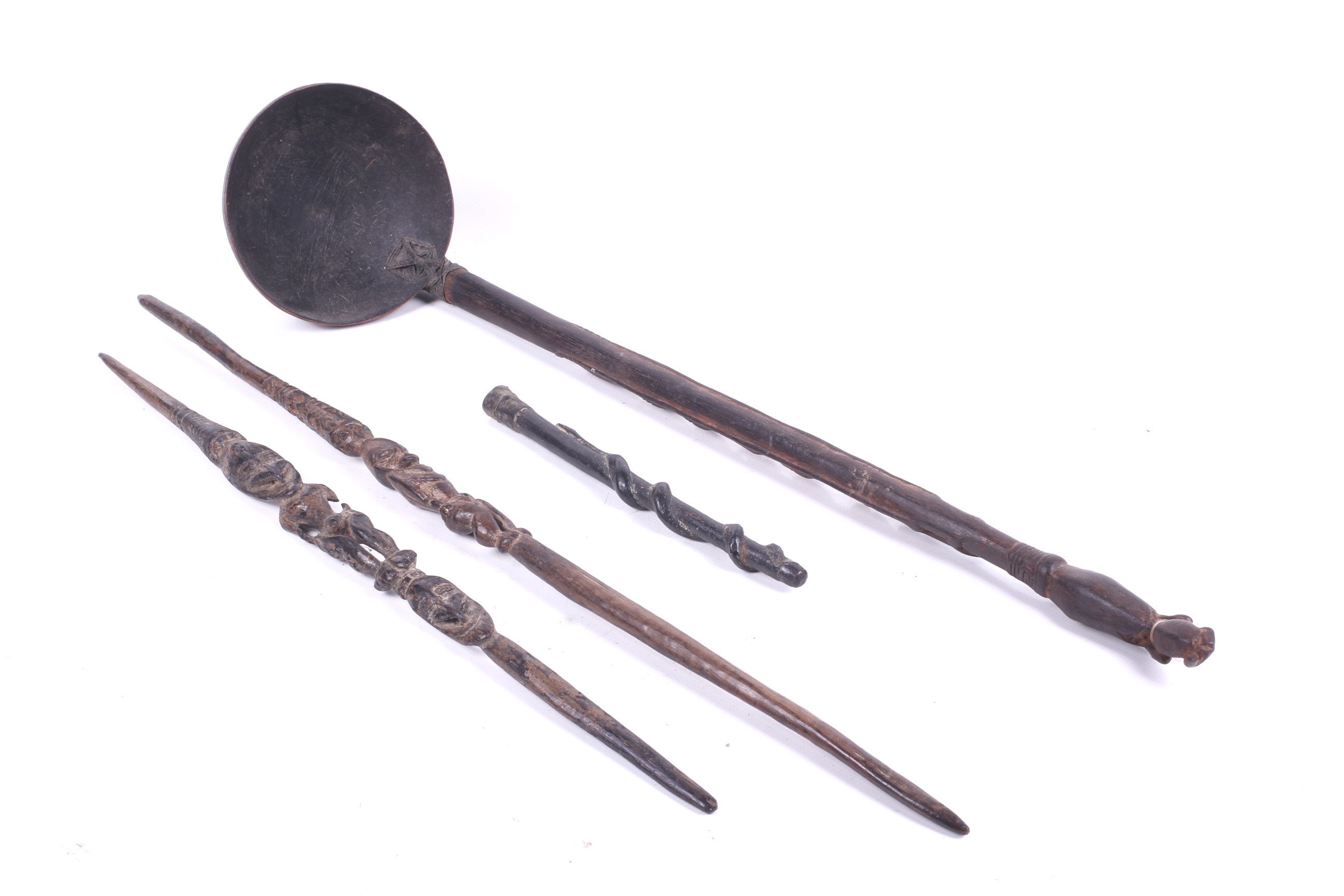 Papua New Guinea. A large carved ladle, two 'scepters' and a handle.