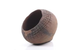 Papua New Guinea. An earthenware cooking pot and a red example.