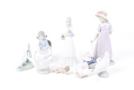 Eight Lladro and Nao figures.