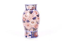 A small Japanese vase. With Imari decoration of chrysanthemums and leaves.