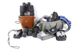An assortment of film cameras and binoculars.