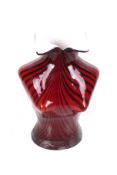 A Murano style striped cased glass vase in the form of a female torso with a flared collar.
