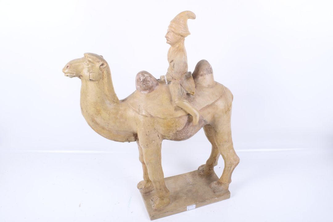 A large Chinese Tang Dynasty earthenware camel and rider. - Image 2 of 5