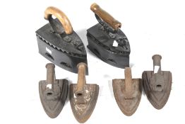 Six antique irons. Including two with wooden handles.