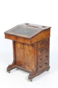 A 19th century walnut veneered Davenport desk.