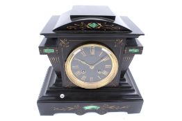 A Victorian slate and malachite mantel clock.