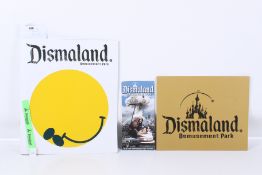 A collection of Dismaland merchandise.