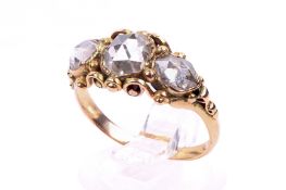 An antique three stone diamond ring.