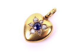 An early 20th century yellow metal heart shaped hinged picture locket.