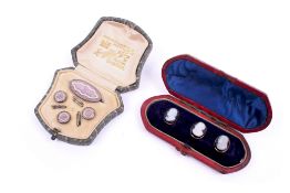 Two sets of dress studs.