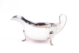 A silver sauce boat. With fluted rim, hallmarks for Sheffield 1933, Viners Ltd. Weight 3.29 oz.