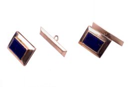 A pair of yellow metal and lapis lazuli cufflinks.