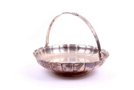A silver swing handled footed dish.