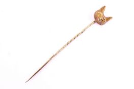 An early 20th century gold fox mask stick pin.