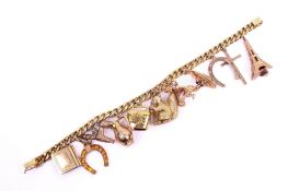 A gold and yellow metal charm bracelet.